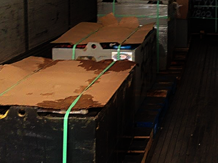 Forklift batteries loaded on the truck.